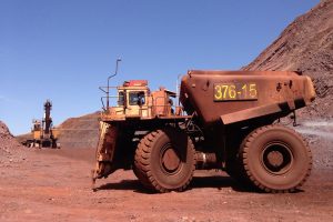 Large mining truck at a quarry in Thabazimbi, South Africa, under clear blue sky.